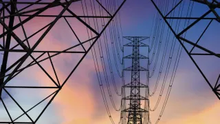 power lines and tower in sunset light